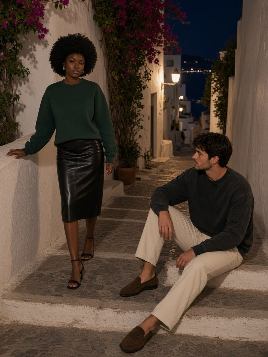 Two people in the Drop Shoulder Crewneck Sweatshirt in Retro Green and Washed Black on a sconce-lit stairway in Positano at night