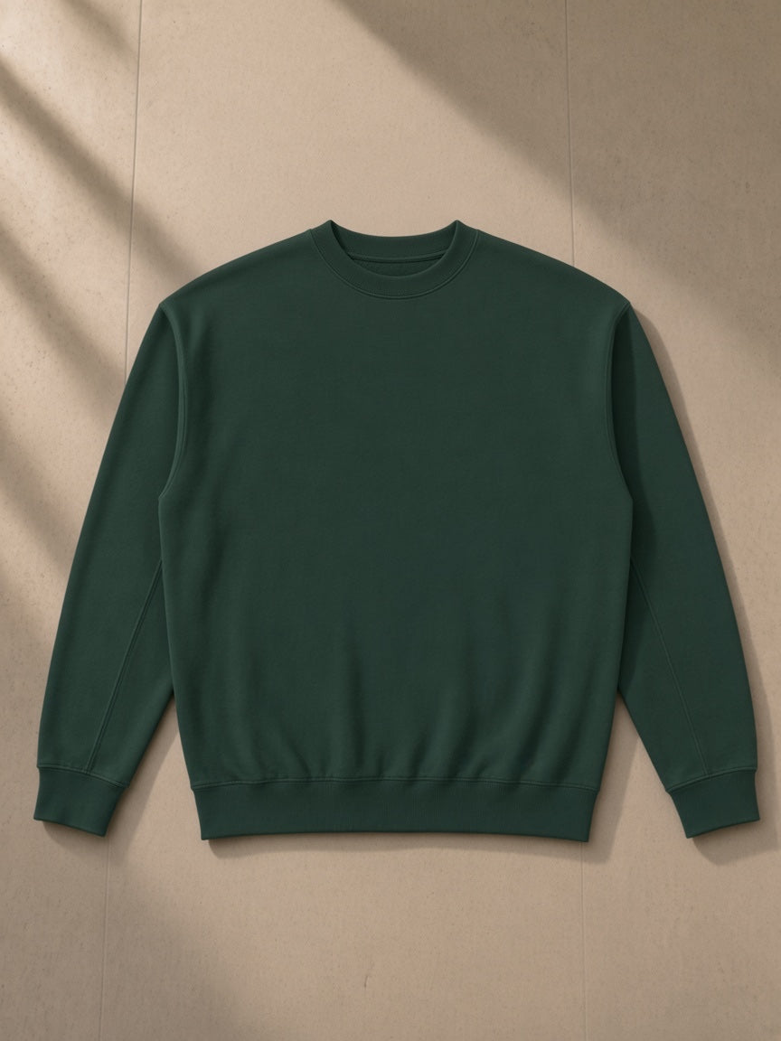 Drop Shoulder Crewneck Sweatshirt in Retro Green, laid flat on pale limestone, front view