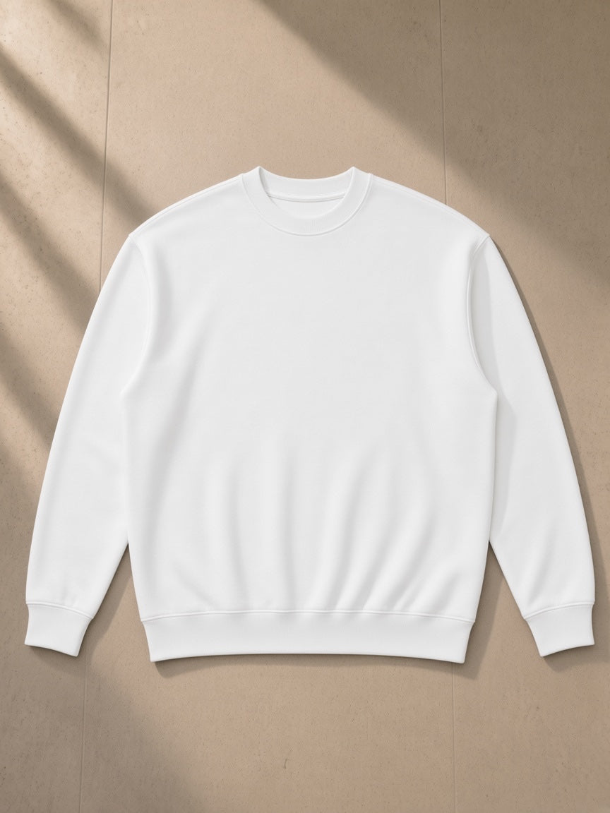 Drop Shoulder Crewneck Sweatshirt in White, laid flat on pale limestone, front view