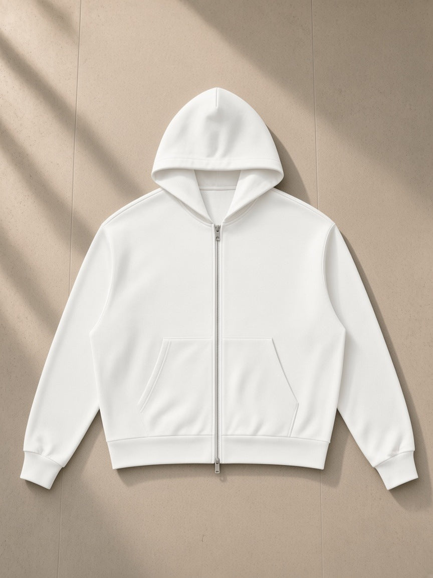 Drop Shoulder Full Zip Hoodie in White, laid flat on pale limestone