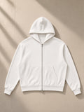 Women's Drop Shoulder Full Zip Hoodie in White, laid flat on pale limestone
