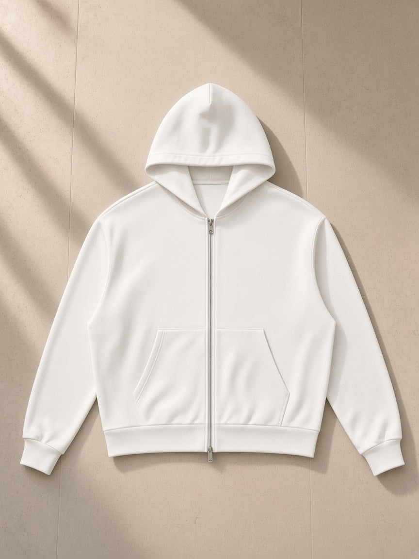 Women's Drop Shoulder Full Zip Hoodie in White, laid flat on pale limestone