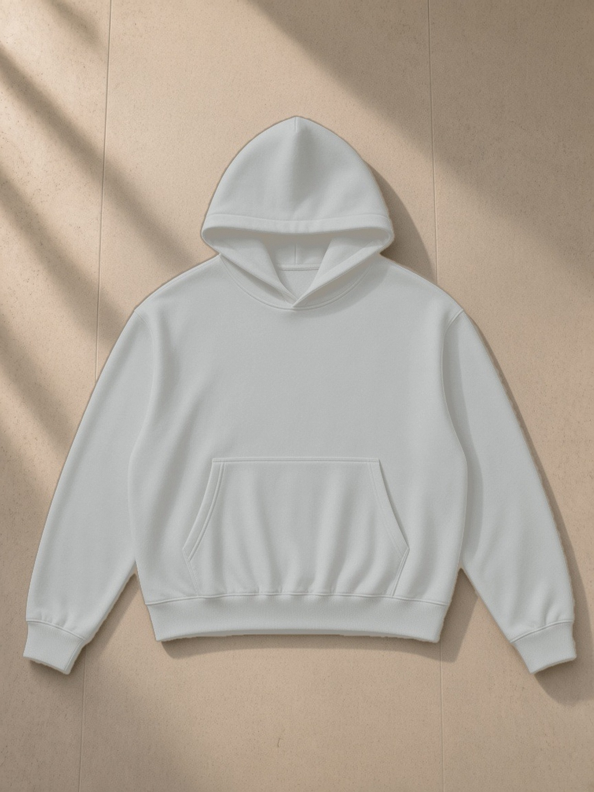 Oversized Drop Shoulder Hoodie in Flower Gray, laid flat on pale limestone, front view
