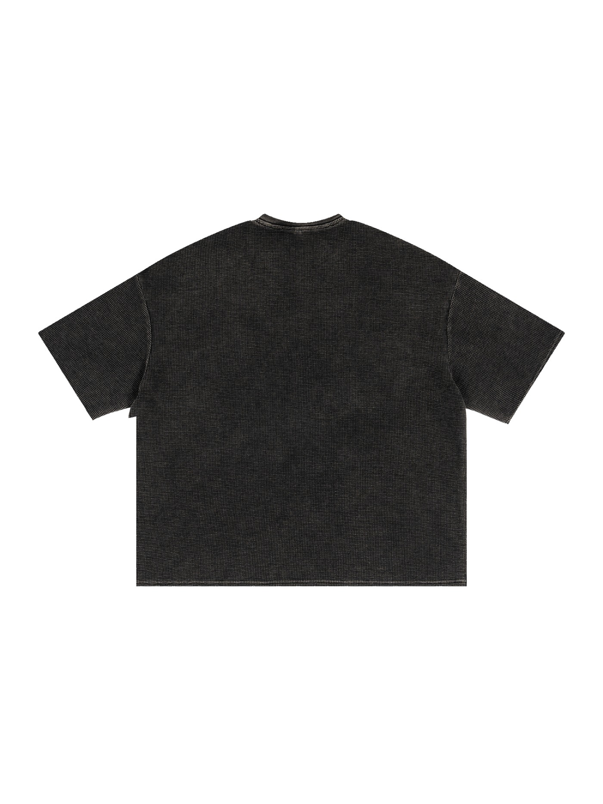 Textured Waffle Washed Boxy T-Shirt in Black, laid flat on pale limestone, back view