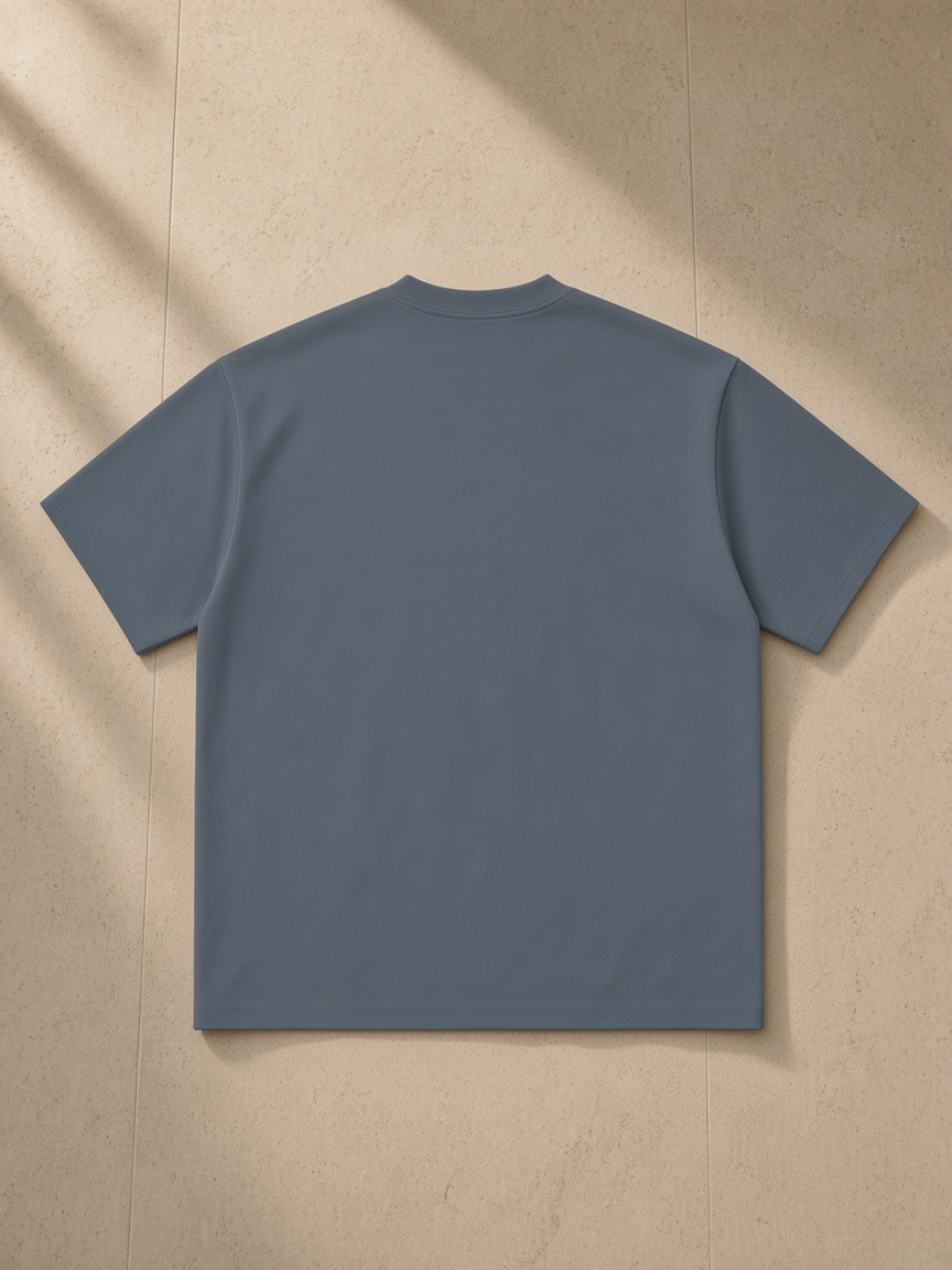 Back of the Haze Blue Men's Heavyweight Drop Shoulder T-Shirt, laid flat