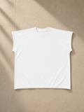Unisex raw edge boxy non-shrink t-shirt in White, laid flat on pale limestone