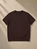Crewneck Knit T-Shirt in Brown, laid flat on pale limestone