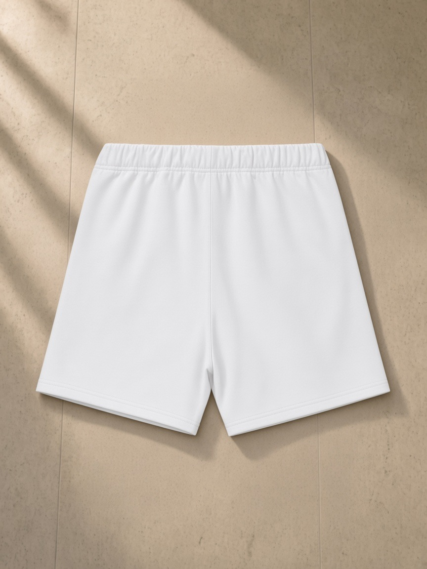 Heavyweight Fleece Loose Fit Shorts in Lucent White, laid flat on pale limestone, back.