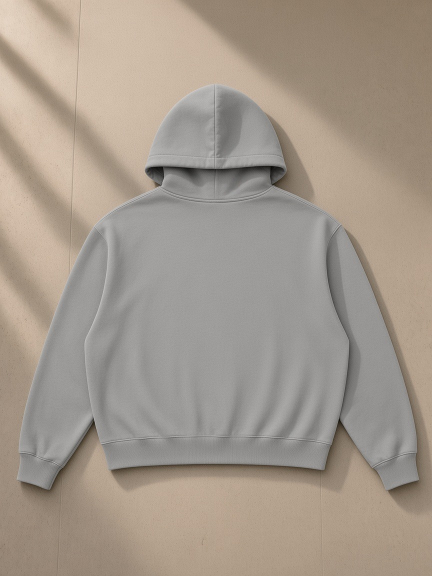 Vintage Wash Boxy Full Zip Hoodie in Light Gray, laid flat on pale limestone, back view
