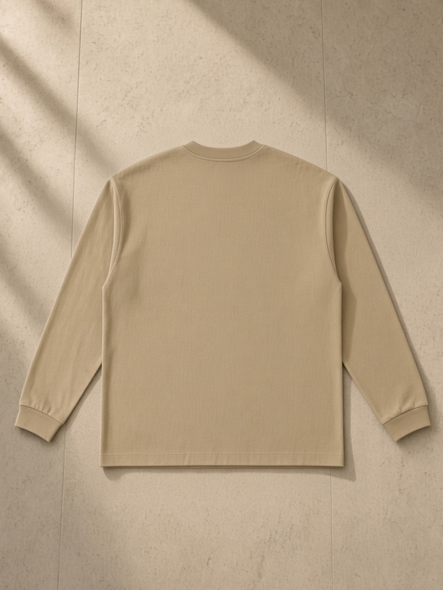 Essential Cotton Long Sleeve T-Shirt in Khaki, laid flat on pale limestone, back.