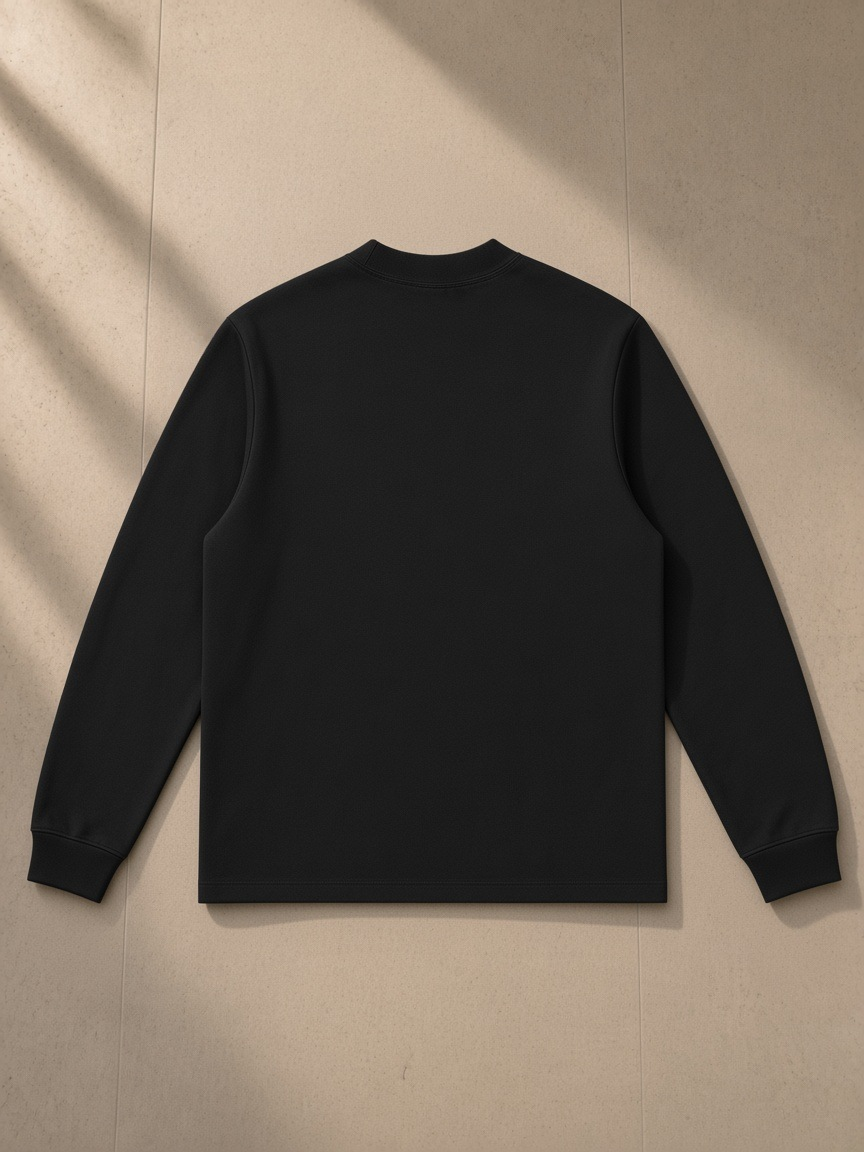 Mock Neck Sweatshirt in Black, laid flat on pale limestone, back view