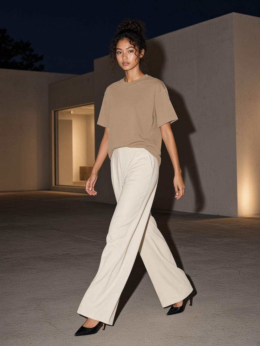 Woman in the Enzyme Washed T-Shirt in Camel walking a gallery street in Hannam-dong, Seoul at night
