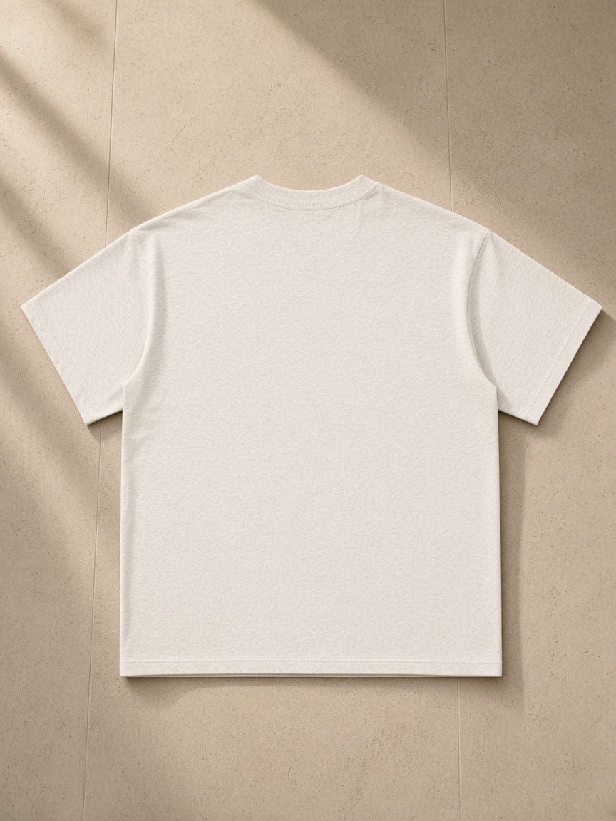 Essential Cotton T-Shirt, 260 gsm, Drop Shoulder in Oat Gray, laid flat on pale limestone, back view