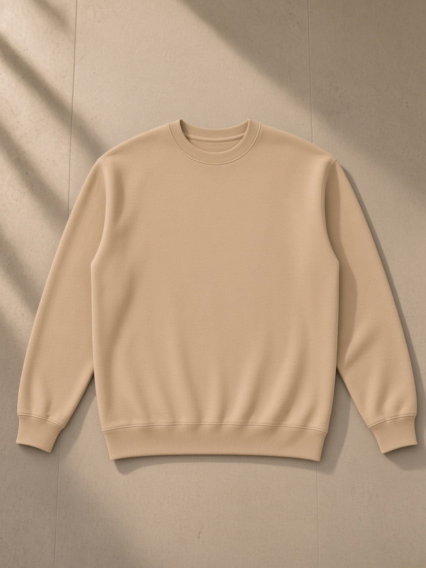 Essential heavyweight crewneck sweatshirt in Camel, laid flat on pale limestone, front view