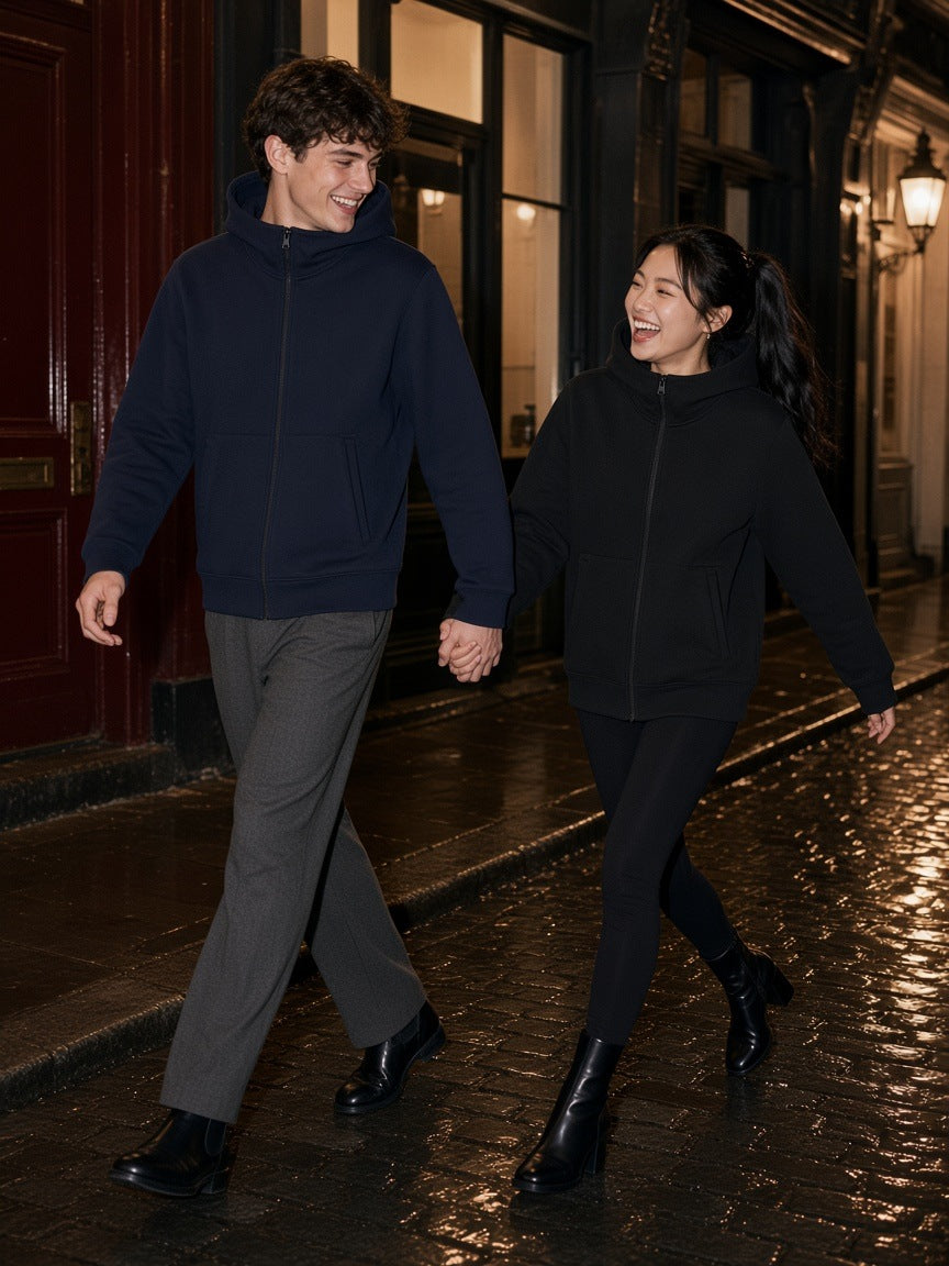 Two people in the Marcel Afters Essential Heavyweight High Neck Zip-Up Hoodie in Navy Blue and Black on a wet London mews at night