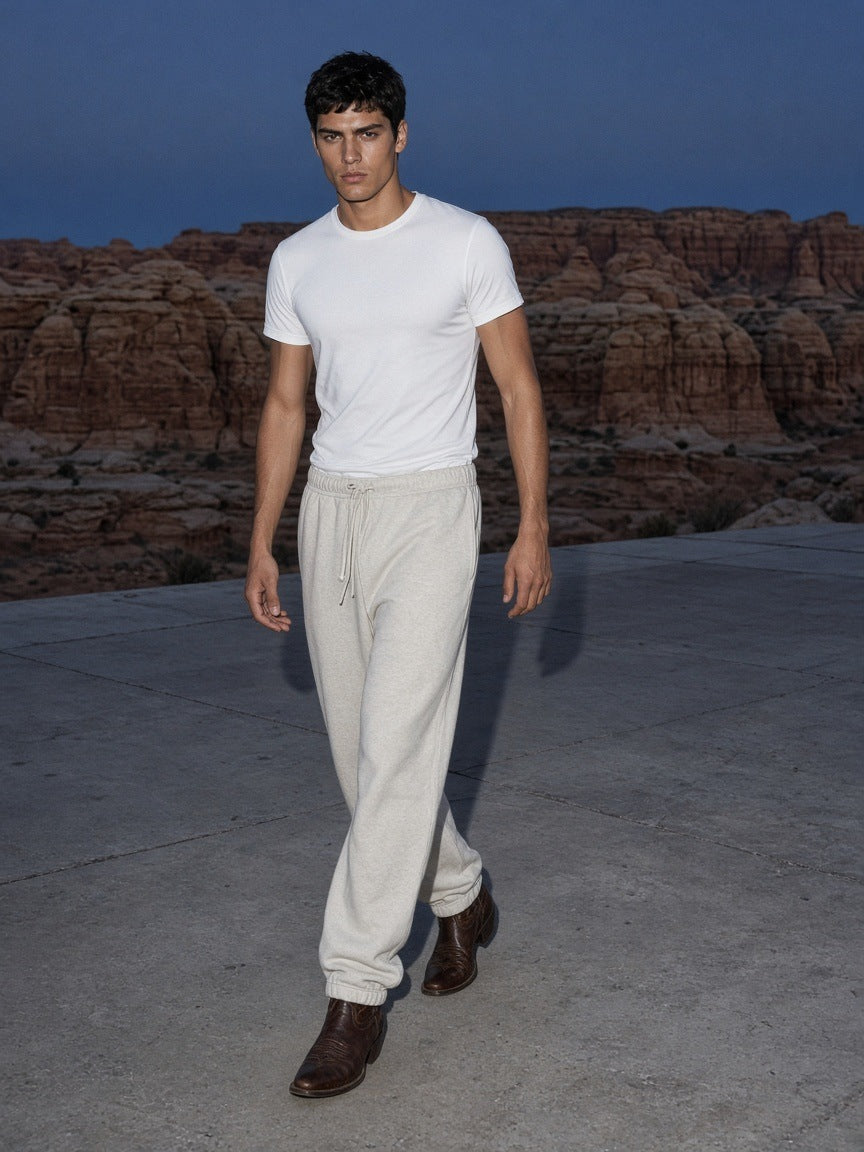 Essential Jogged Sweatpants in Oat Gray, à deux, worn by him