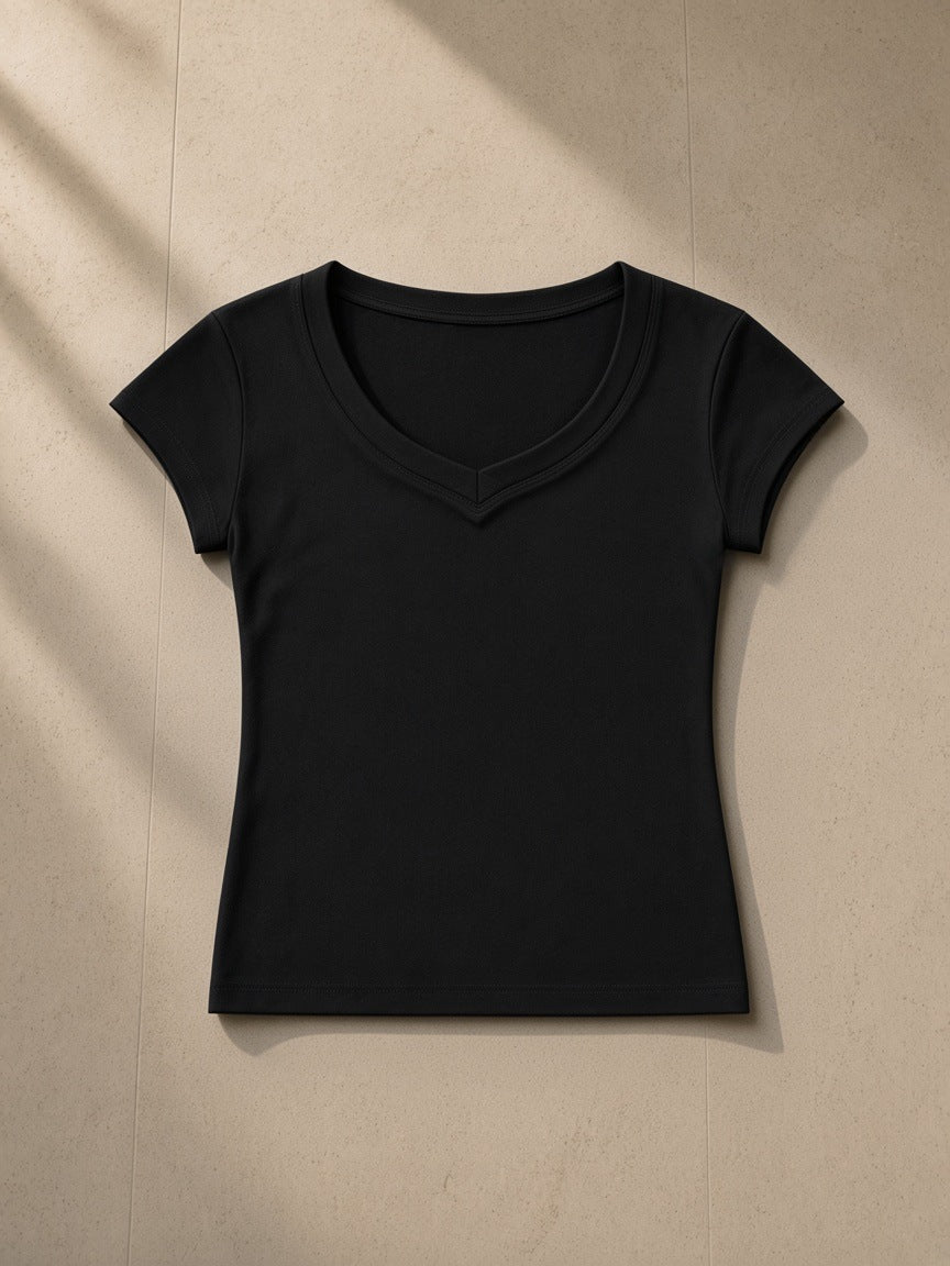 Essential V-Neck Bodycon T-Shirt in Black, laid flat on pale limestone
