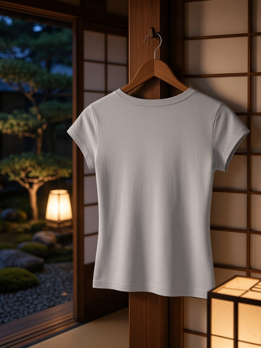 Essential V-Neck Bodycon T-Shirt in Light Gray on a wooden hanger hooked on a cedar shoji frame in a Kyoto ryokan at night
