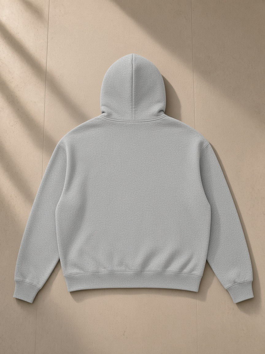 Men's drop shoulder full-zip hoodie in Flower Gray, laid flat on pale limestone, back view