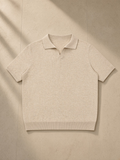 Unisex Heavyweight Oversized Polo Shirt in Mild Apricot, laid flat on pale limestone