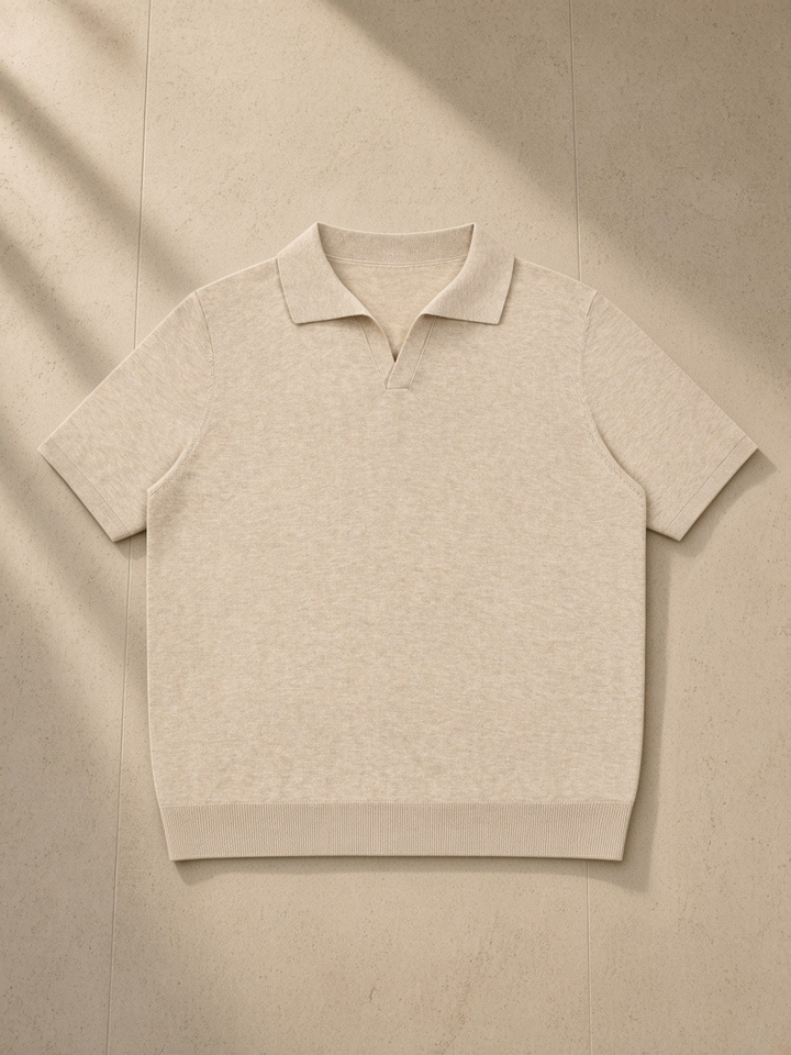 Unisex Heavyweight Oversized Polo Shirt in Mild Apricot, laid flat on pale limestone