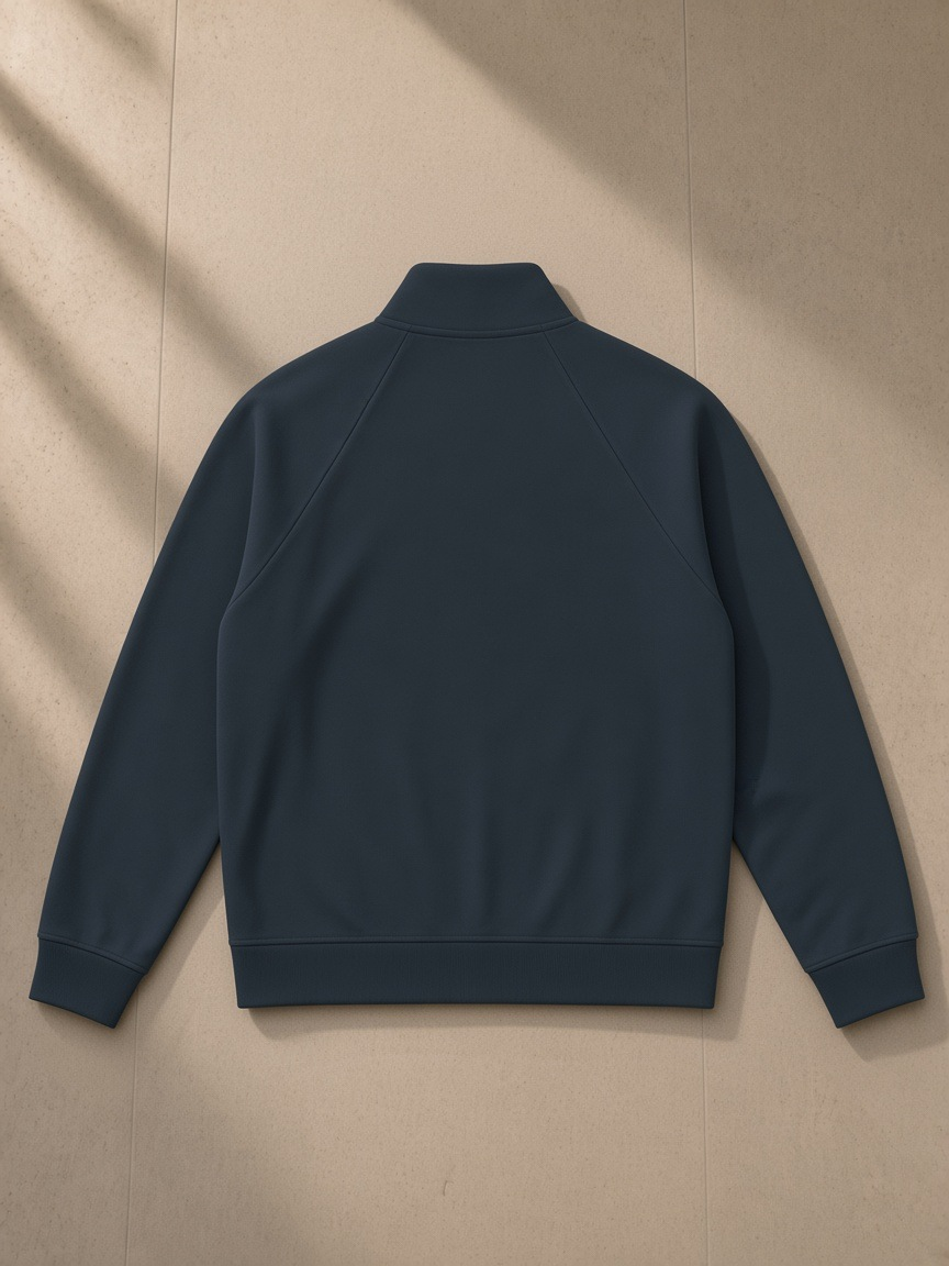 Zip-Pocket Stand Collar Jacket in Navy Blue, laid flat on pale limestone, back view
