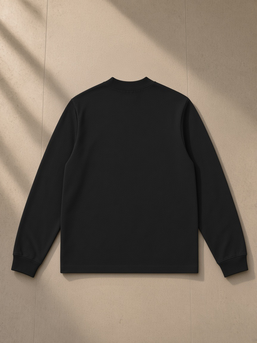 Non-shrink mock neck sweatshirt in Black, laid flat on pale limestone, back view
