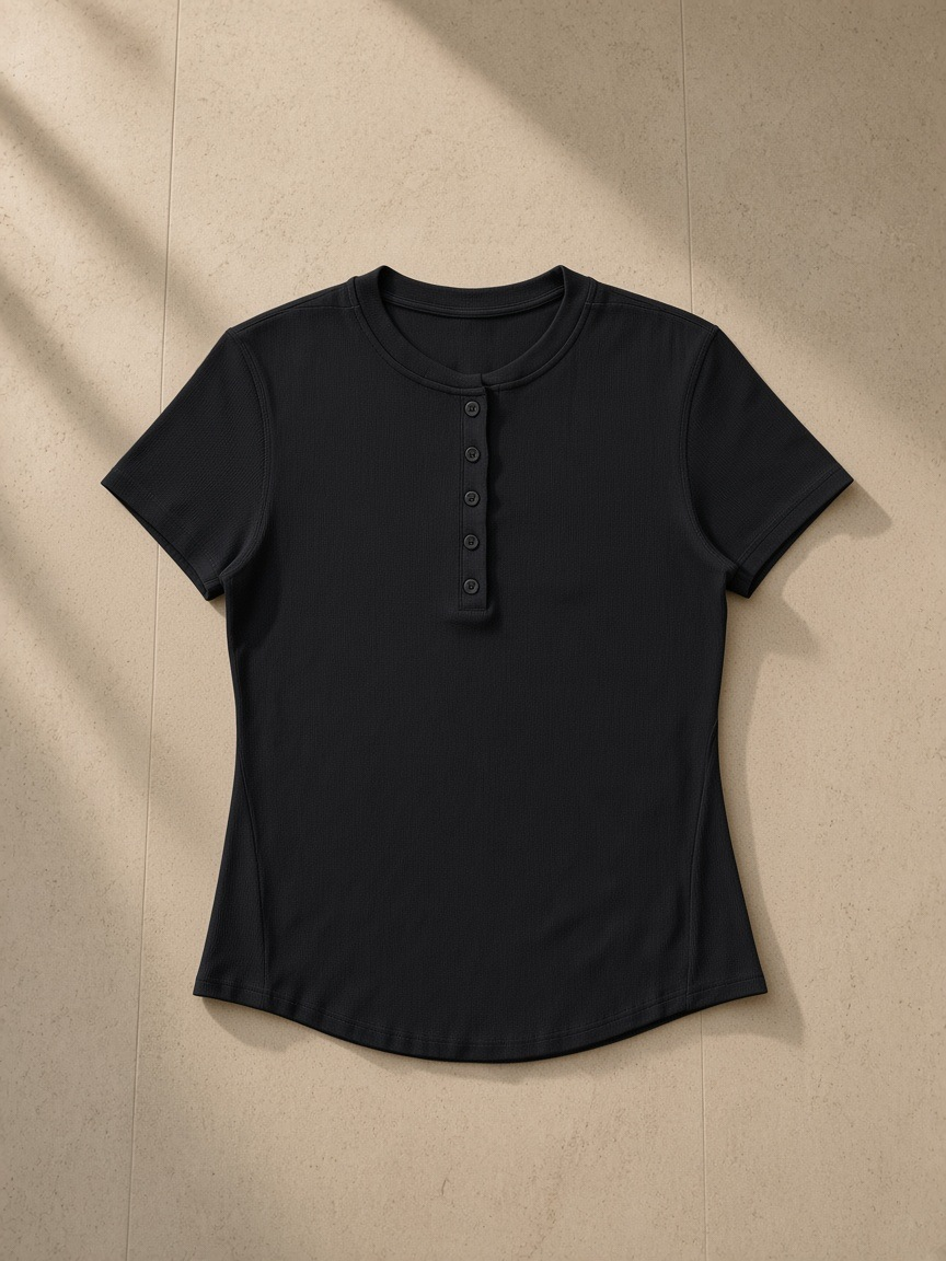 Modal bodycon henley shirt in Black, laid flat on pale limestone