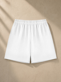 Cotton Shorts in White, laid flat on pale limestone