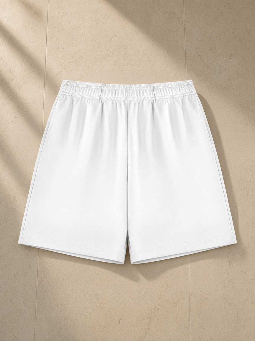 Cotton Shorts in White, laid flat on pale limestone