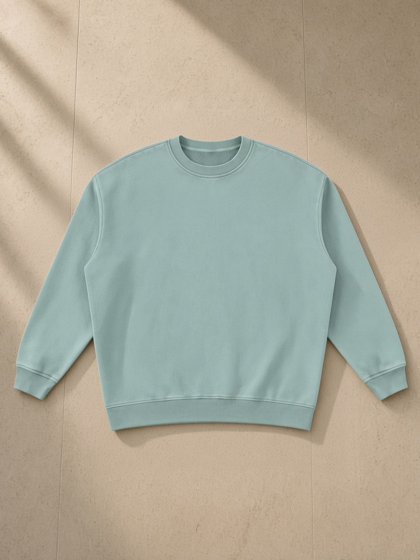 Vintage Wash Fleece Sweatshirt in Lake Blue, laid flat on pale limestone, front.