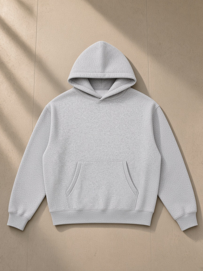 Oversized boxy fit fleece hoodie in Flower Gray, laid flat on pale limestone