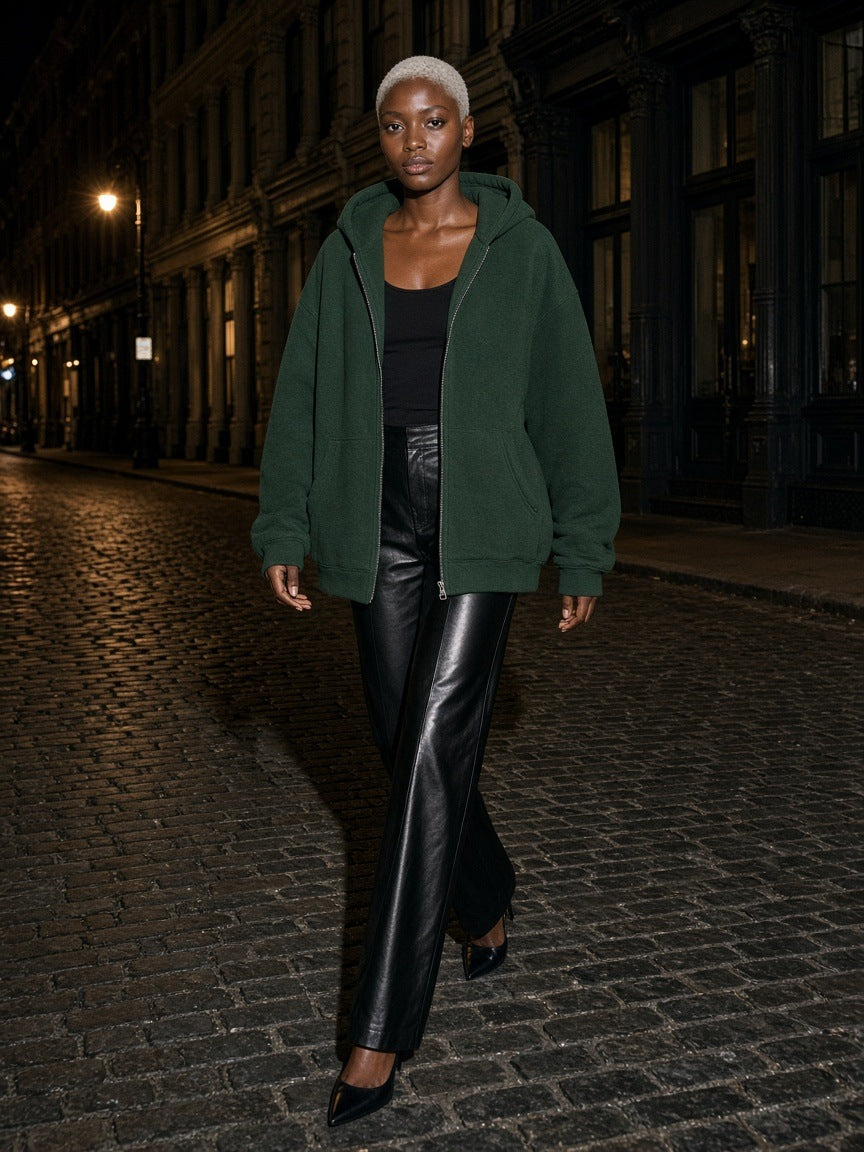 Woman in the Fleece Full Zip Hoodie in Dark Green walking the cobbles of Mercer Street, New York at night
