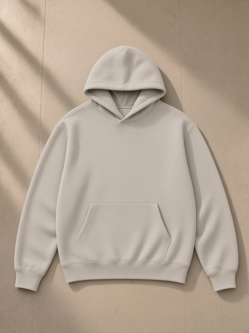 Fleeced high neck hoodie in Oat Gray, laid flat on pale limestone, front view