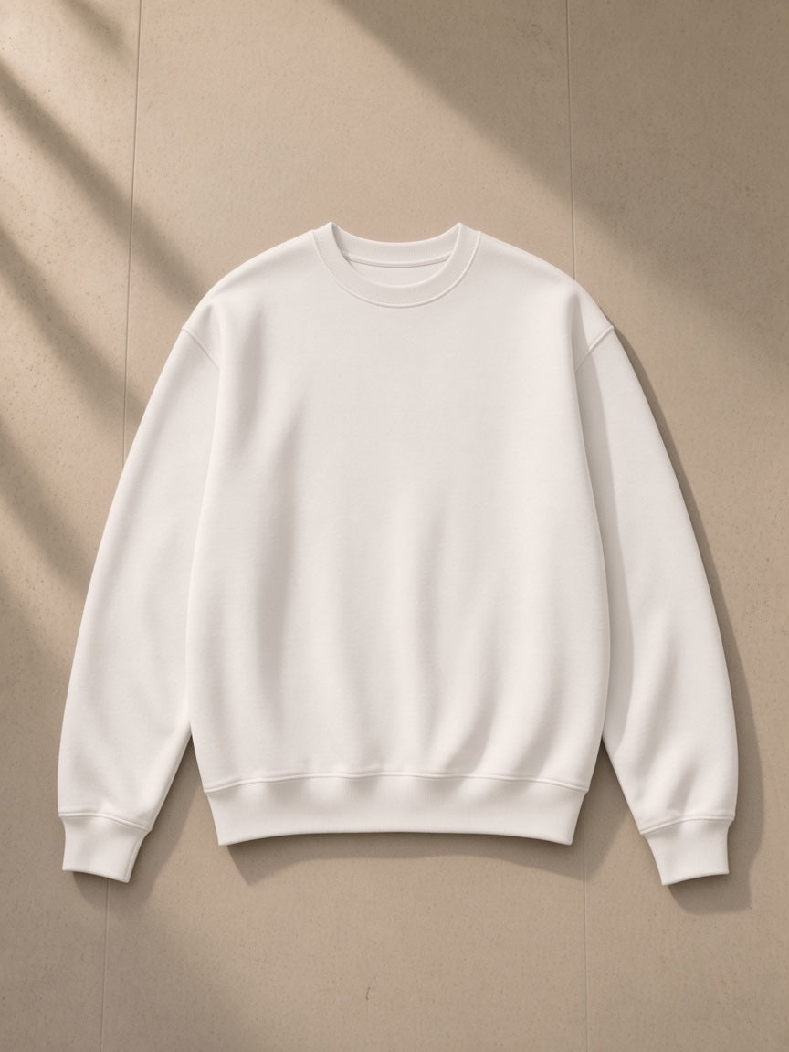 Fleeced sweatshirt in White, laid flat on pale limestone, front view