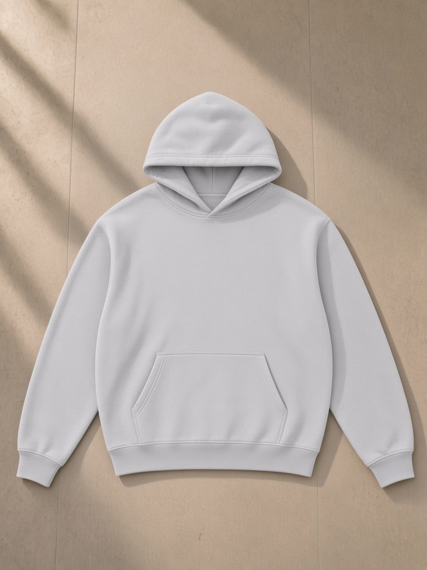 Snow Wash Fleece Oversize Hoodie in Light Gray, laid flat on pale limestone, front view