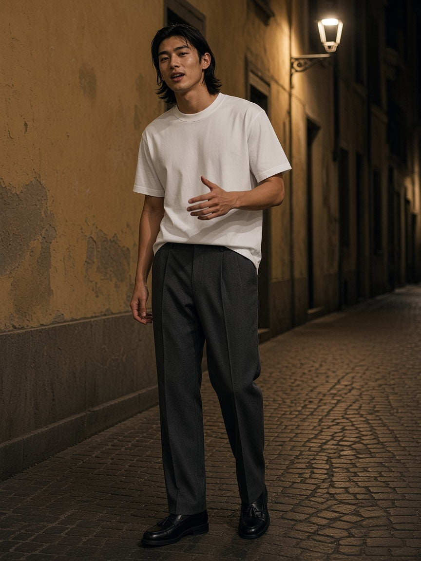 Man in the Heavyweight Drop Shoulder T-Shirt in White on a Brera side street in Milan at night