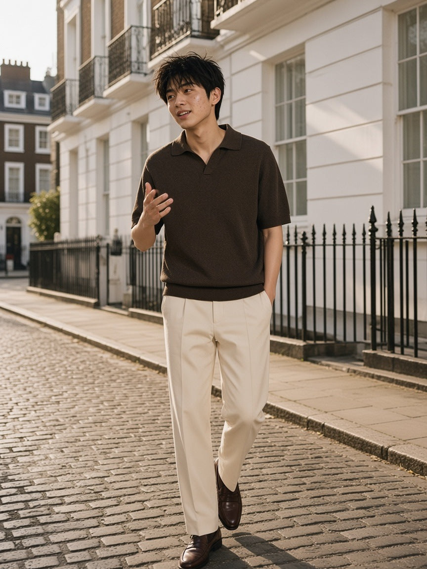 Man in the Heavyweight Oversized Polo in Dark Brown, mid-conversation on the cobbles of a Mayfair mews, London in the morning