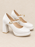 White patent Mary Jane pump with block heel, studio photograph