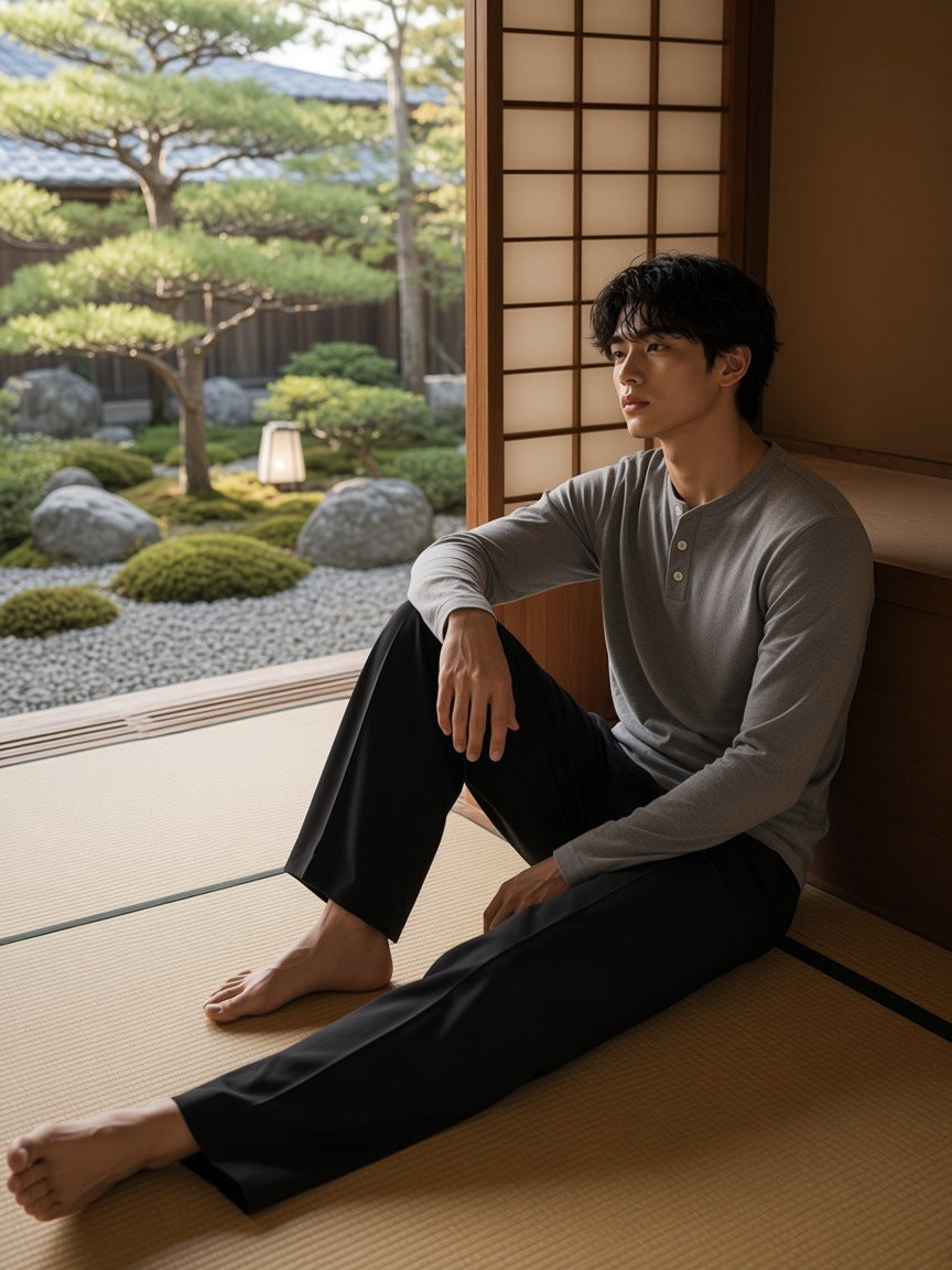 Man in the Long Sleeve Henley T-Shirt in Flower Gray standing in a ryokan room in Kyoto by day