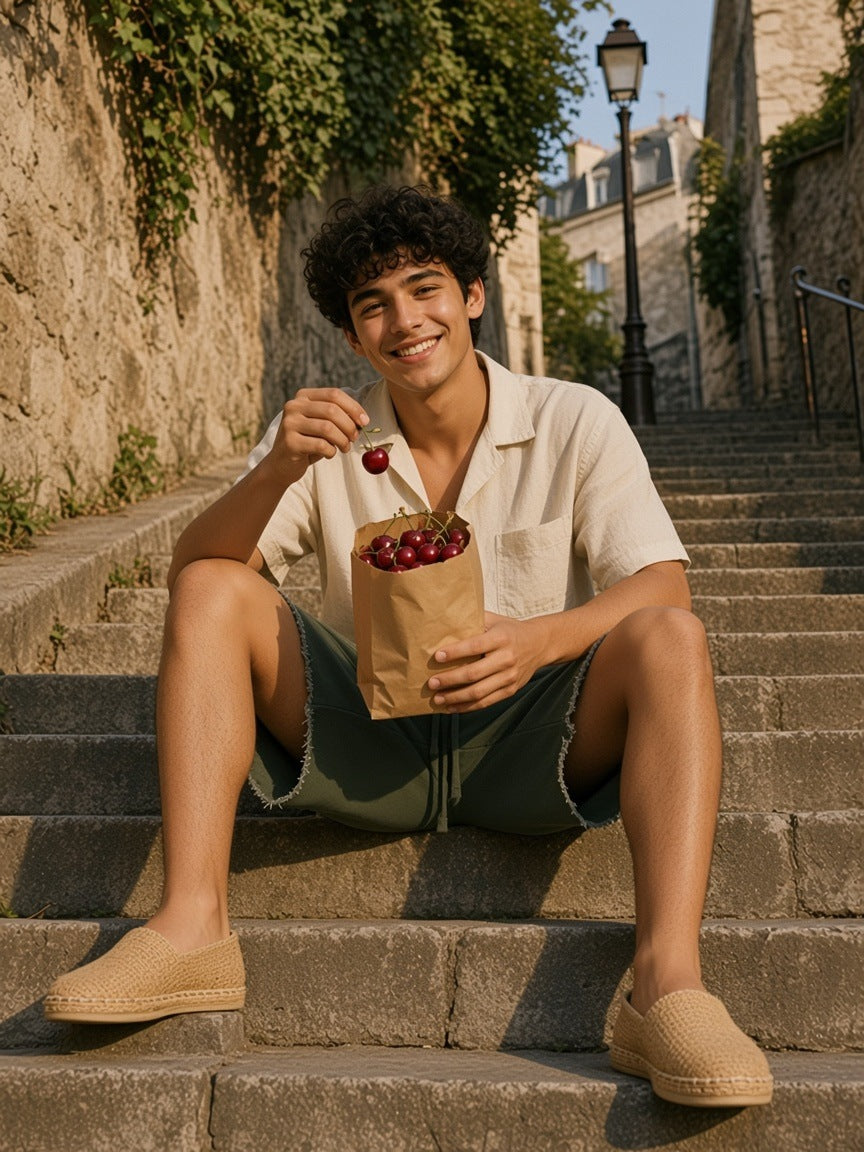 Man in the Loose Raw Edge Shorts in Blackish Green eating cherries on the Montmartre steps