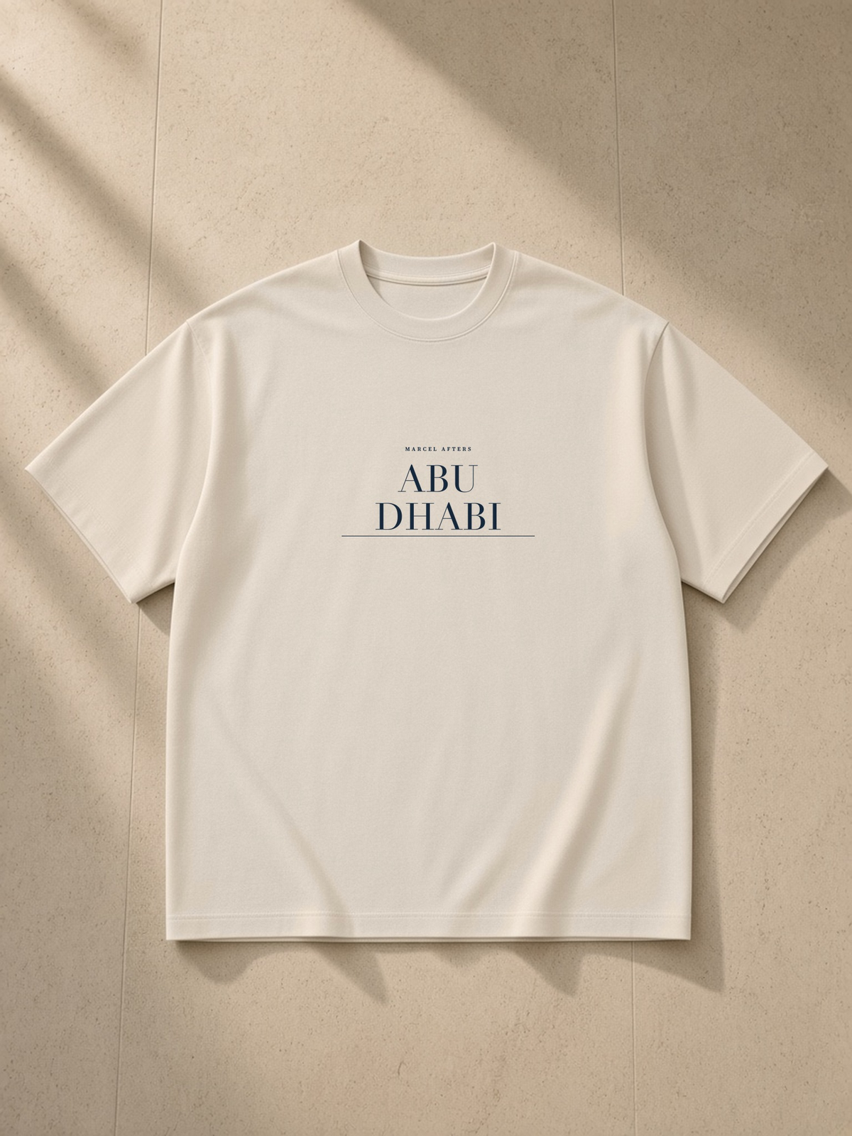 Abu Dhabi heavyweight drop-shoulder t-shirt by Marcel Afters in Light Apricot, front flat lay
