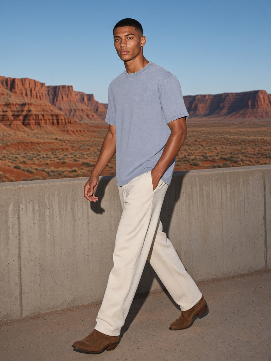 Marcel Afters Bamboo Slub Snow Washed T-Shirt in Blue, worn by a man, desert