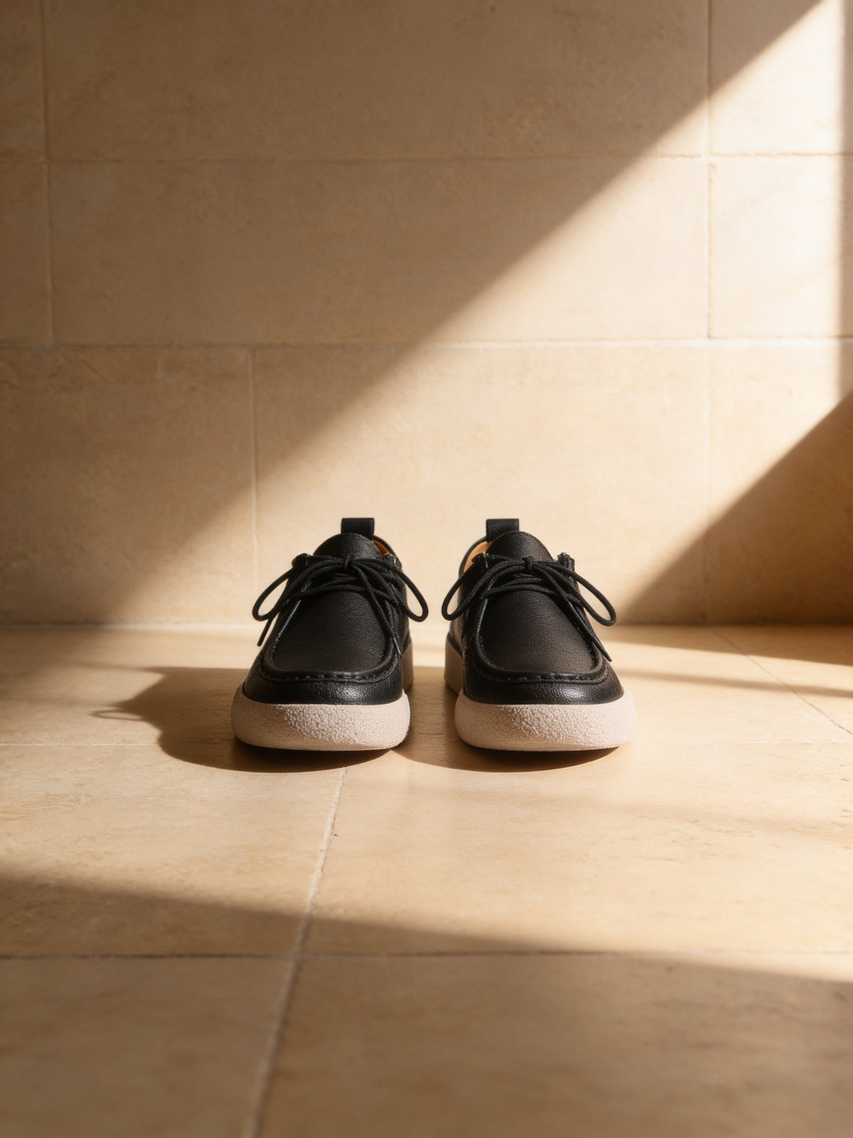 The Marcel Afters The Afterparty Lace-Up, a pair on a pale stone floor in soft daylight