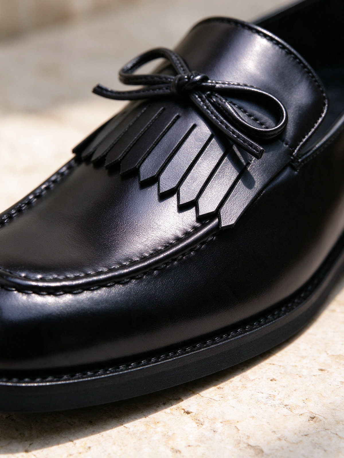 The Ballroom Loafer in black, macro close-up of the detail