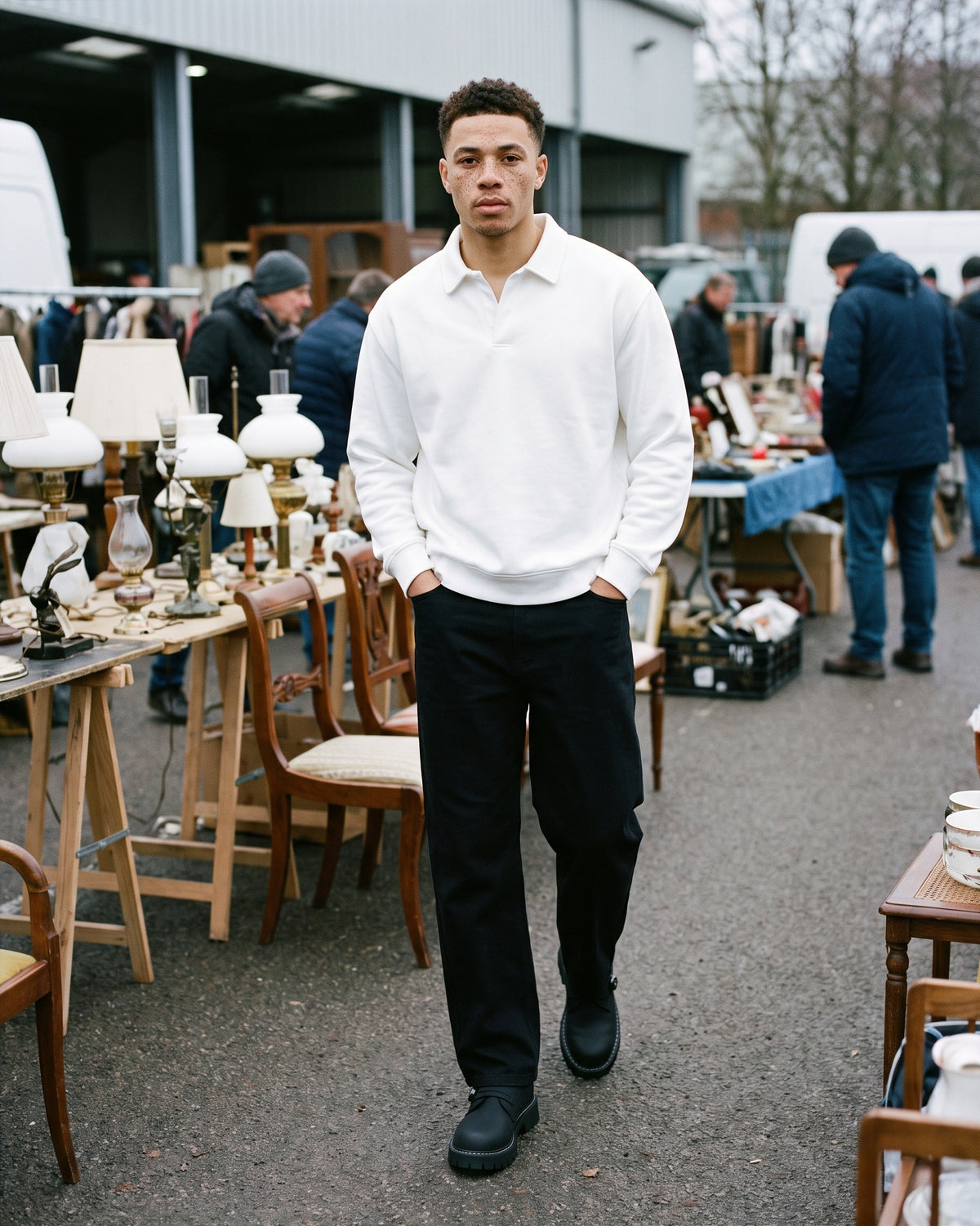 Man wearing The Guest List Monk with the Oversized Collared Sweatshirt in White, Heavyweight Cotton Straight-Leg Pants in Black. Weekend Uniform, Autumn–Winter 2026 campaign