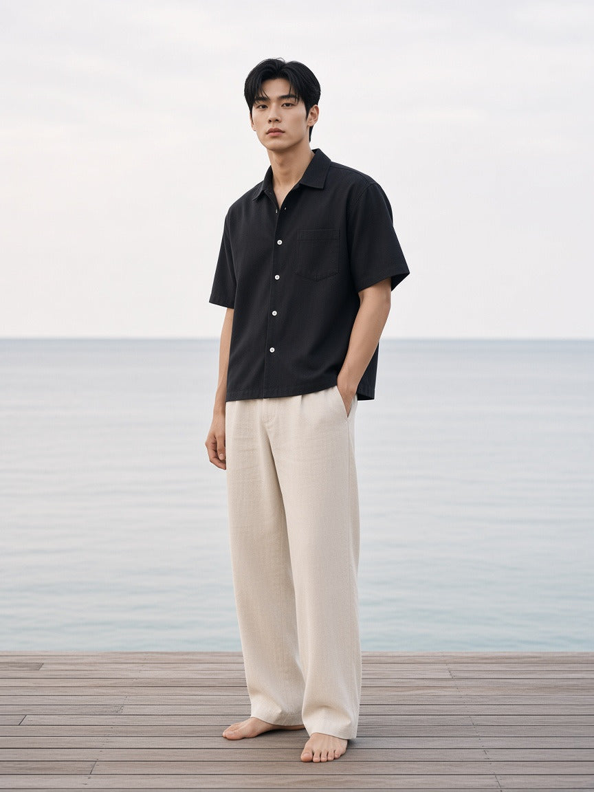 Man wearing the Boxy Heavyweight Short Sleeve Shirt in Black, full-length model photo