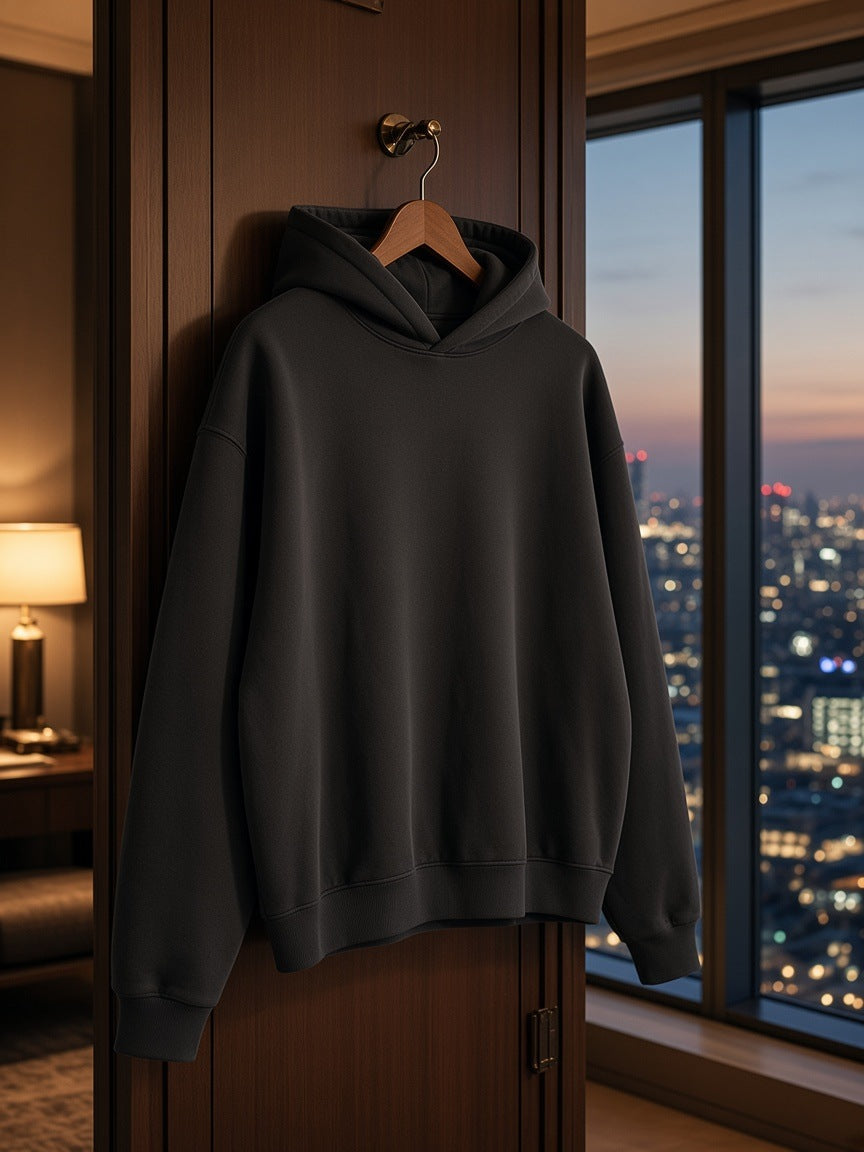 Marcel Afters Boxy Oversized Hoodie in Gray, on a hanger, hotel room