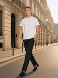 Man wearing the Boxy Raw Edge T-Shirt in White, full-length model photo