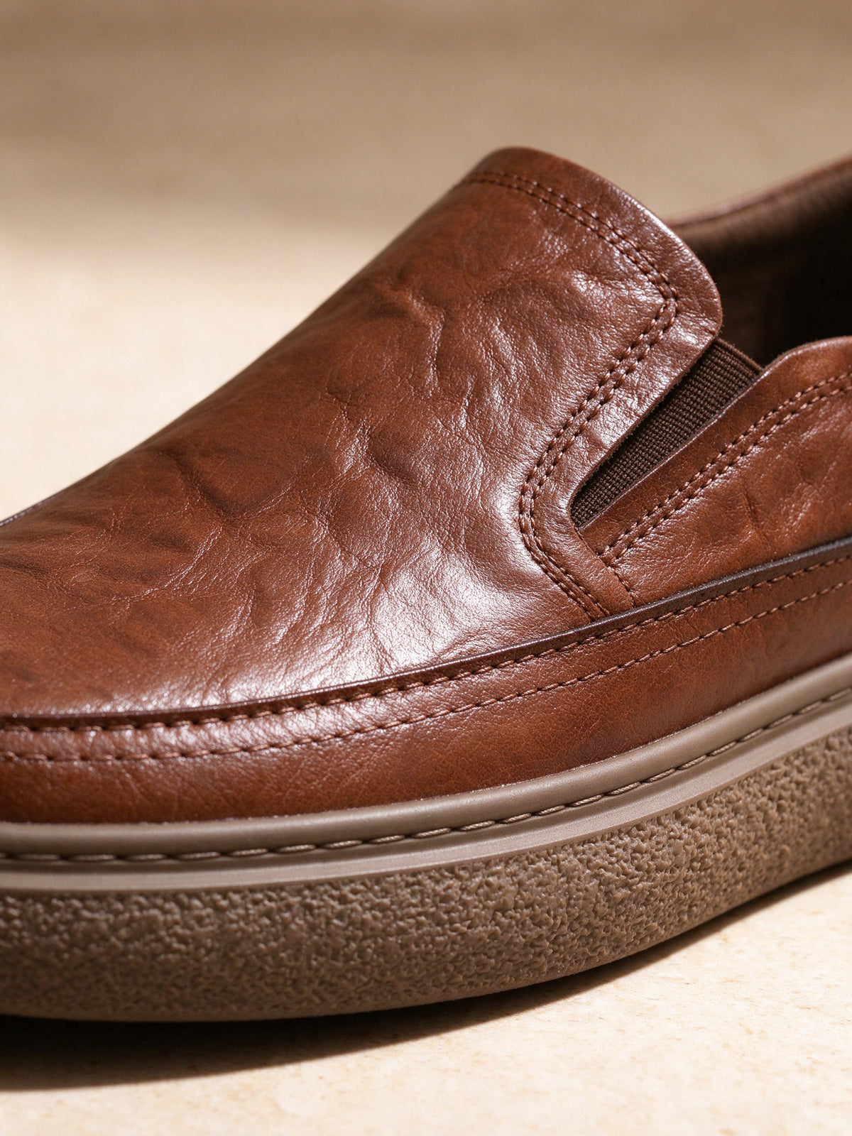 The Day Pass Slip-On in brown, close-up detail